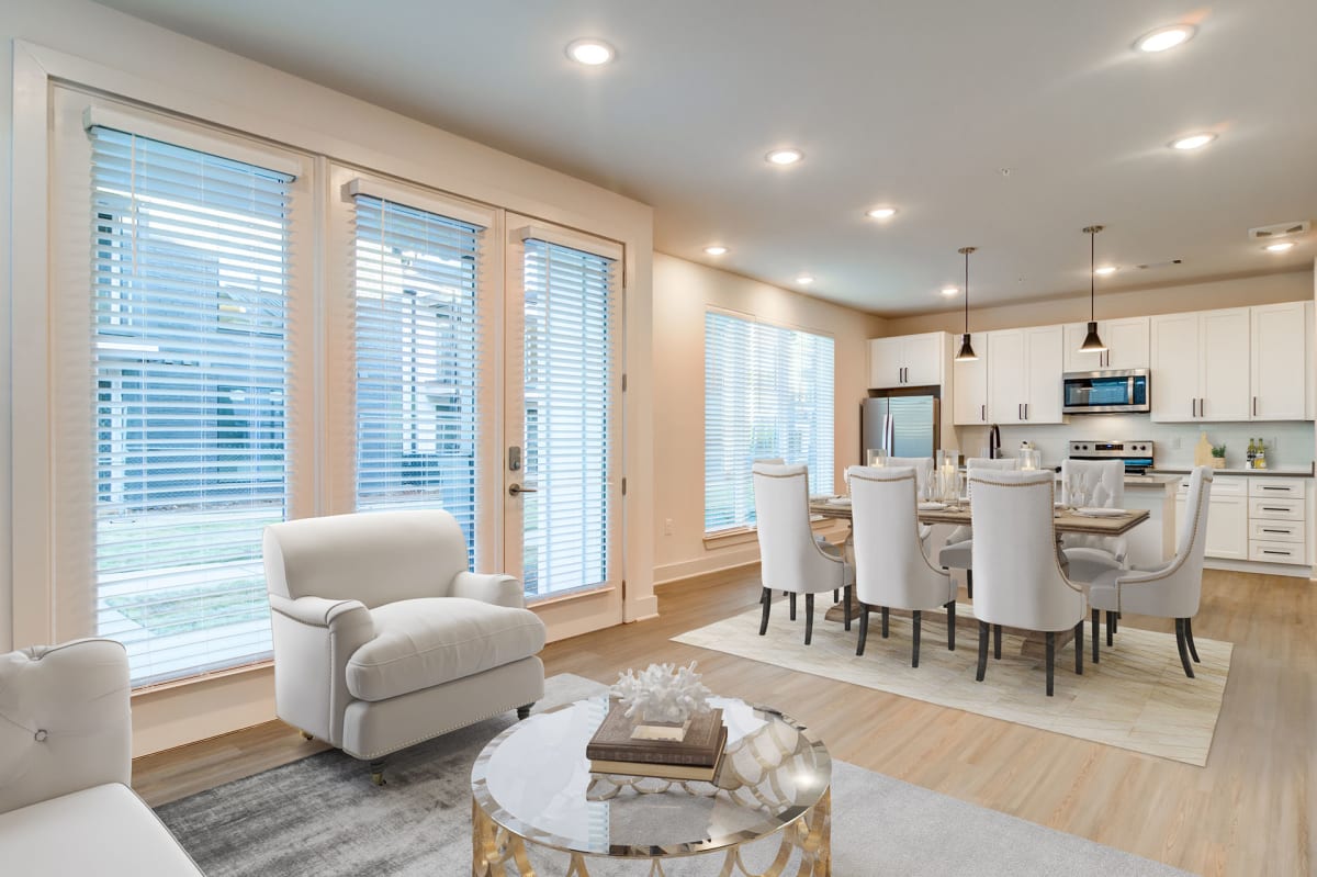 The Collins Luxury Apartments living room with high ceilings - Huntsville, AL