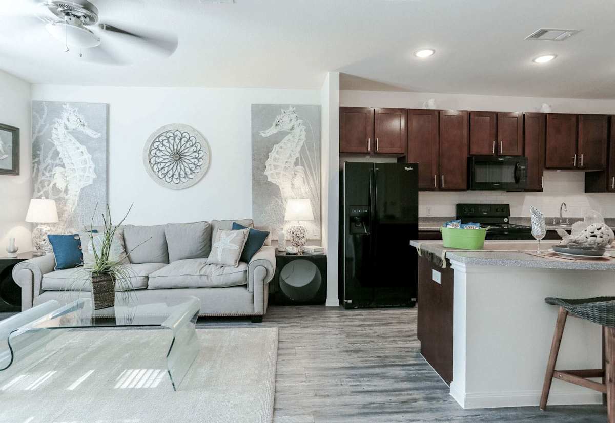The Cove Apartments living room and kitchen view - Ingleside, TX