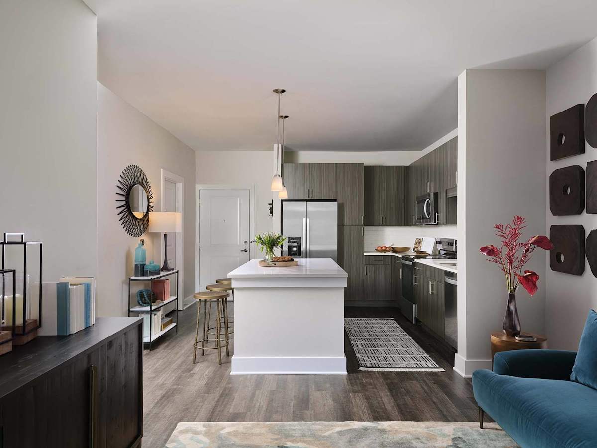 The Kelly at 23rd Luxury Apartments kitchen with island and quartz counters - Panama City, FL