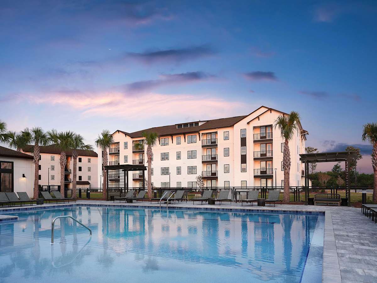 The Kelly at 23rd Luxury Apartments pool at dusk - Panama City, FL