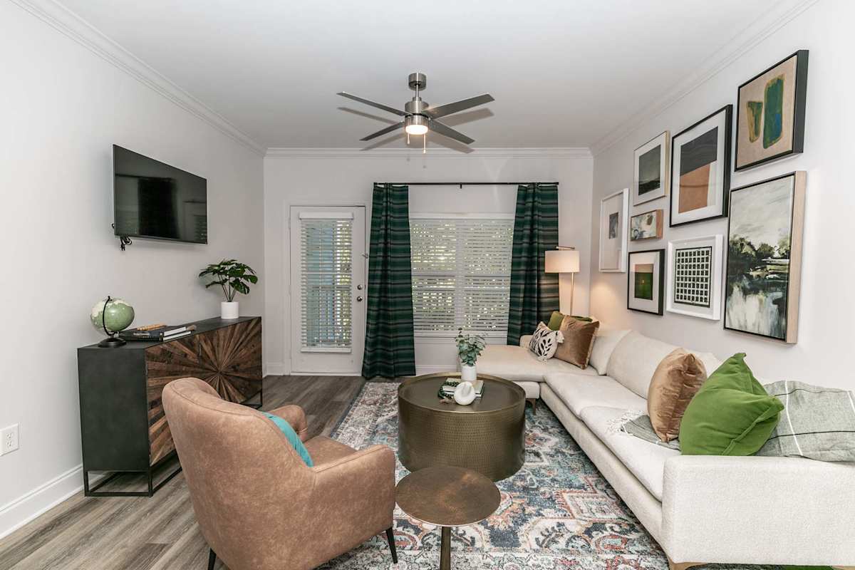 The Jackson Apartments living room with hardwood-style flooring - Newnan, GA