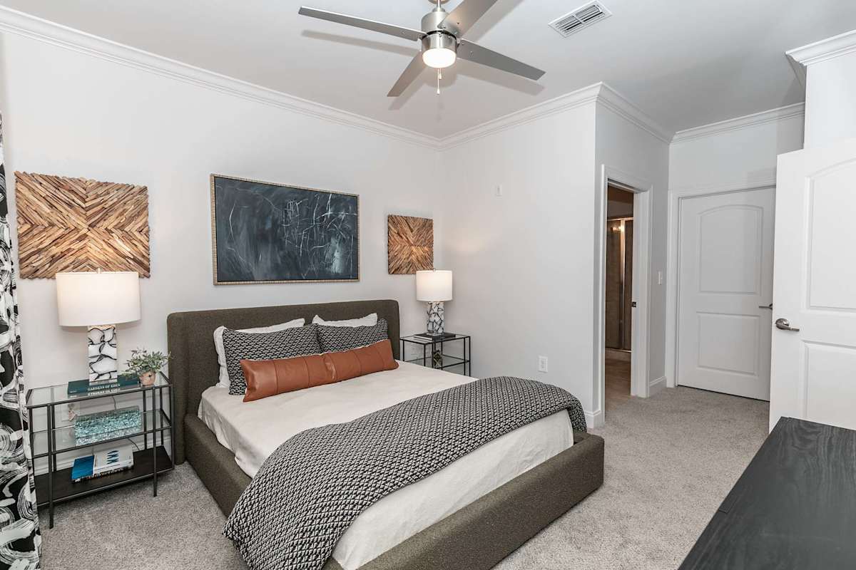 The Jackson Apartments bedroom with ceiling fan - Newnan, GA