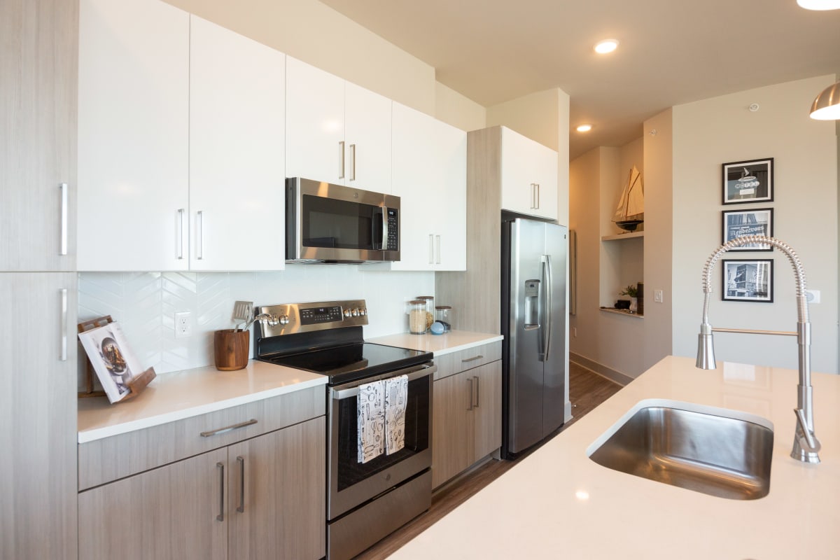 The Landing Residences apartment kitchen with stainless appliances - Memphis, TN