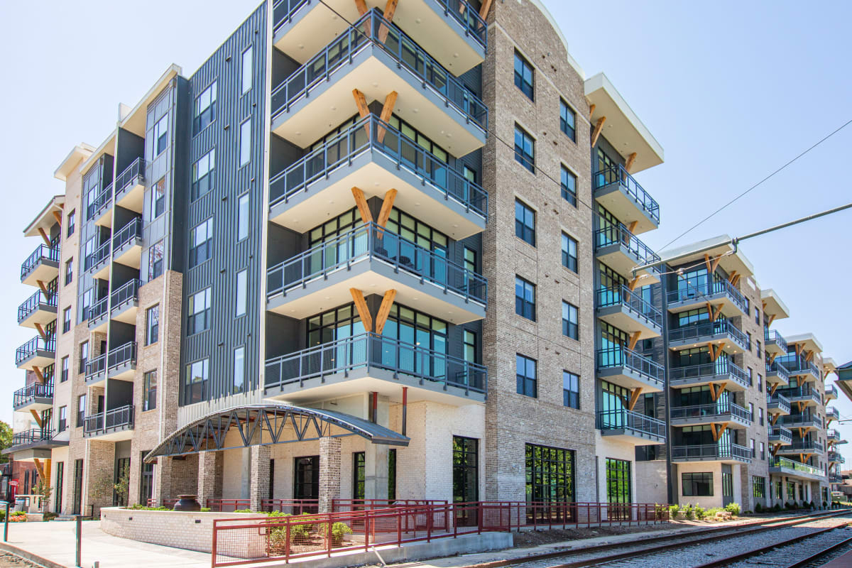 The Landing Residences building street view by trolley tracks - Memphis, TN