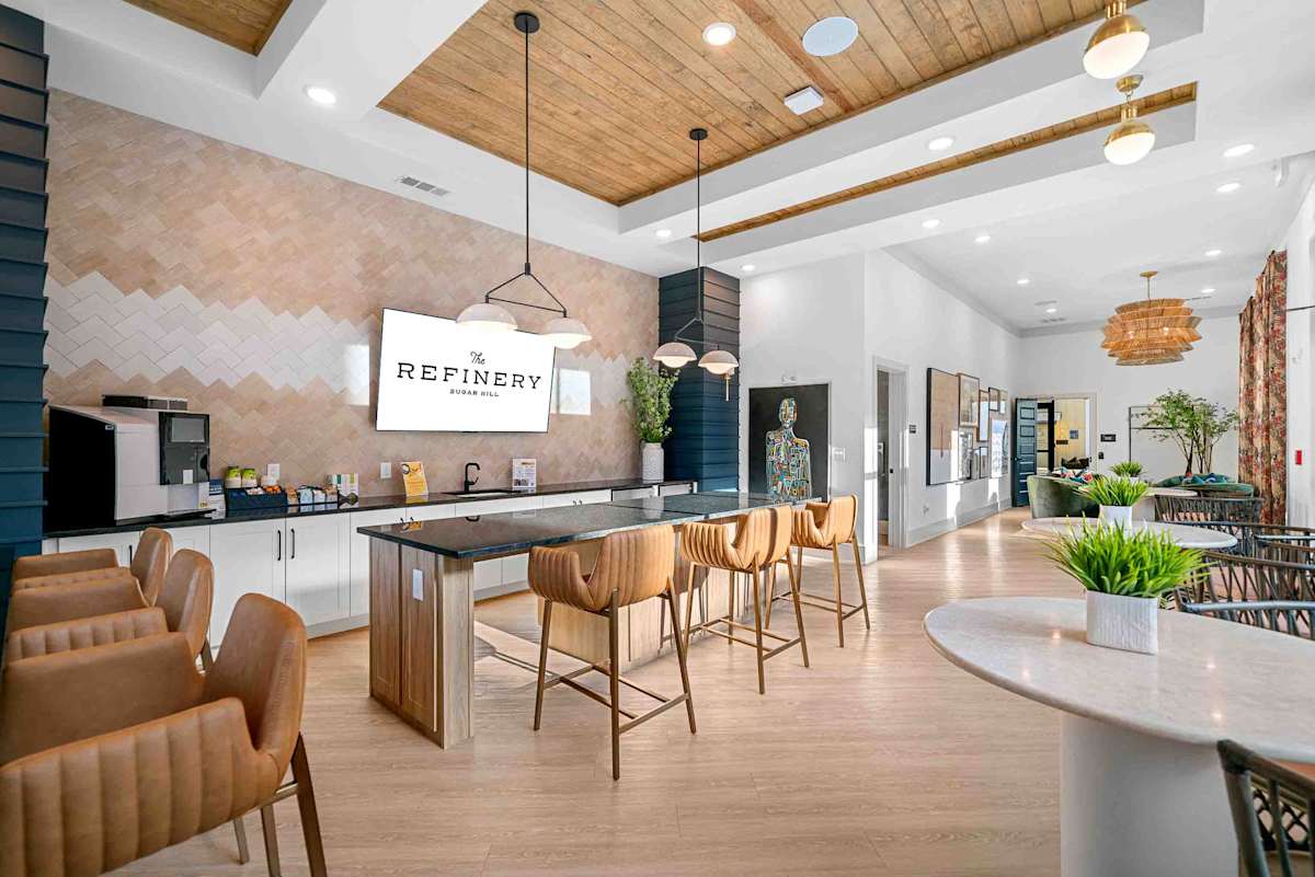The Refinery at Sugar Hill Apartments and Townhomes kitchen with dining area - Sugar Hill, GA