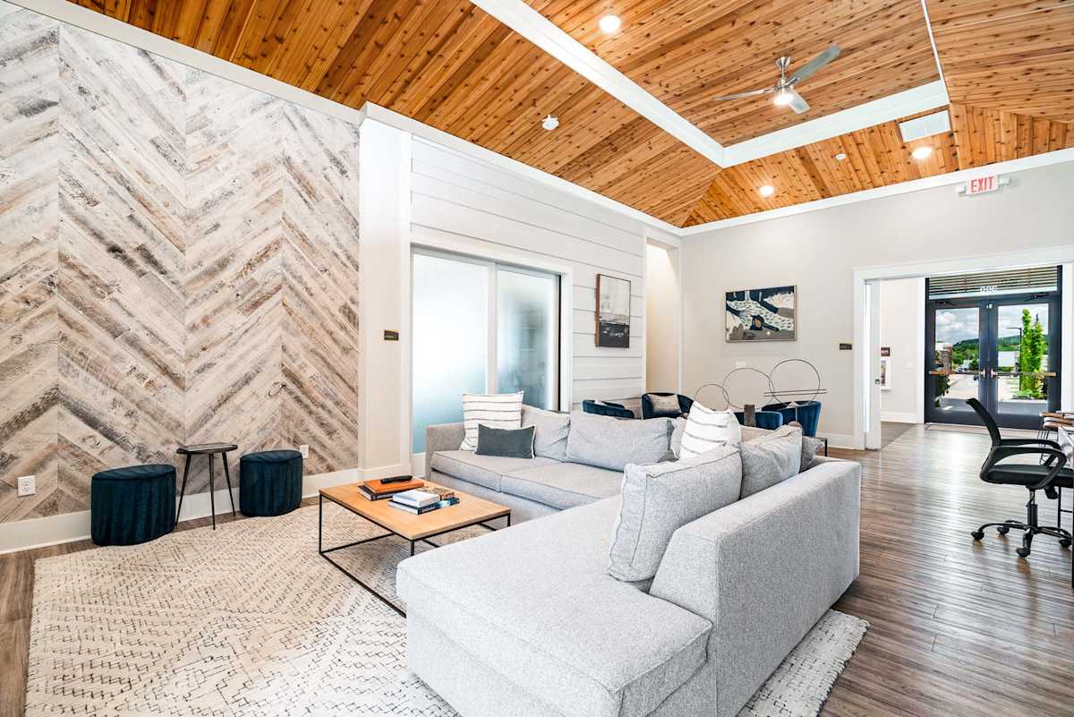 Main Street Lofts living room with couch and wood ceiling - Oak Ridge, TN
