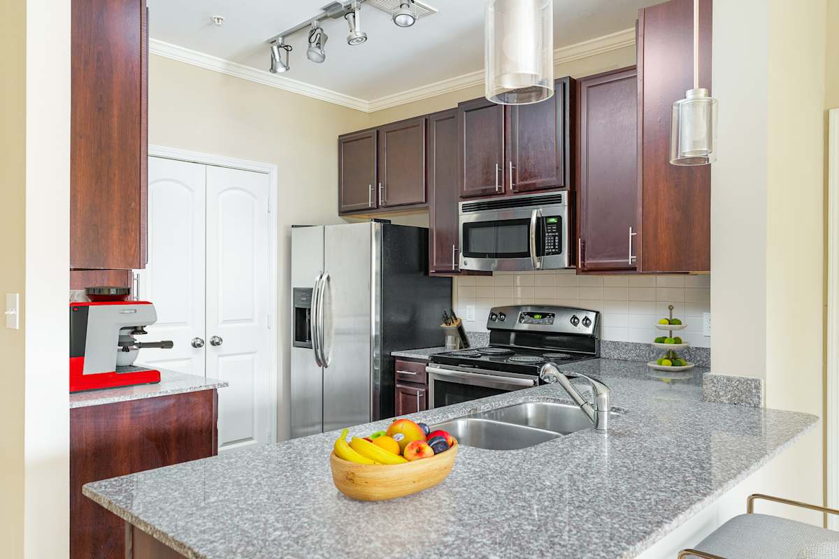 The Reserve at Johnson City Apartments kitchen with granite-style counters - Johnson City, TN