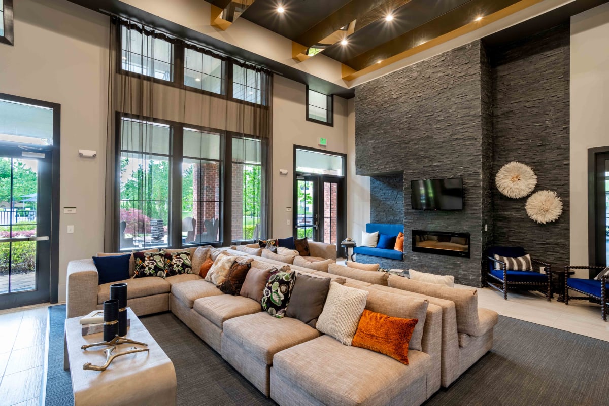 Velo Verdae Apartments clubhouse seating area with fireplace - Greenville, SC