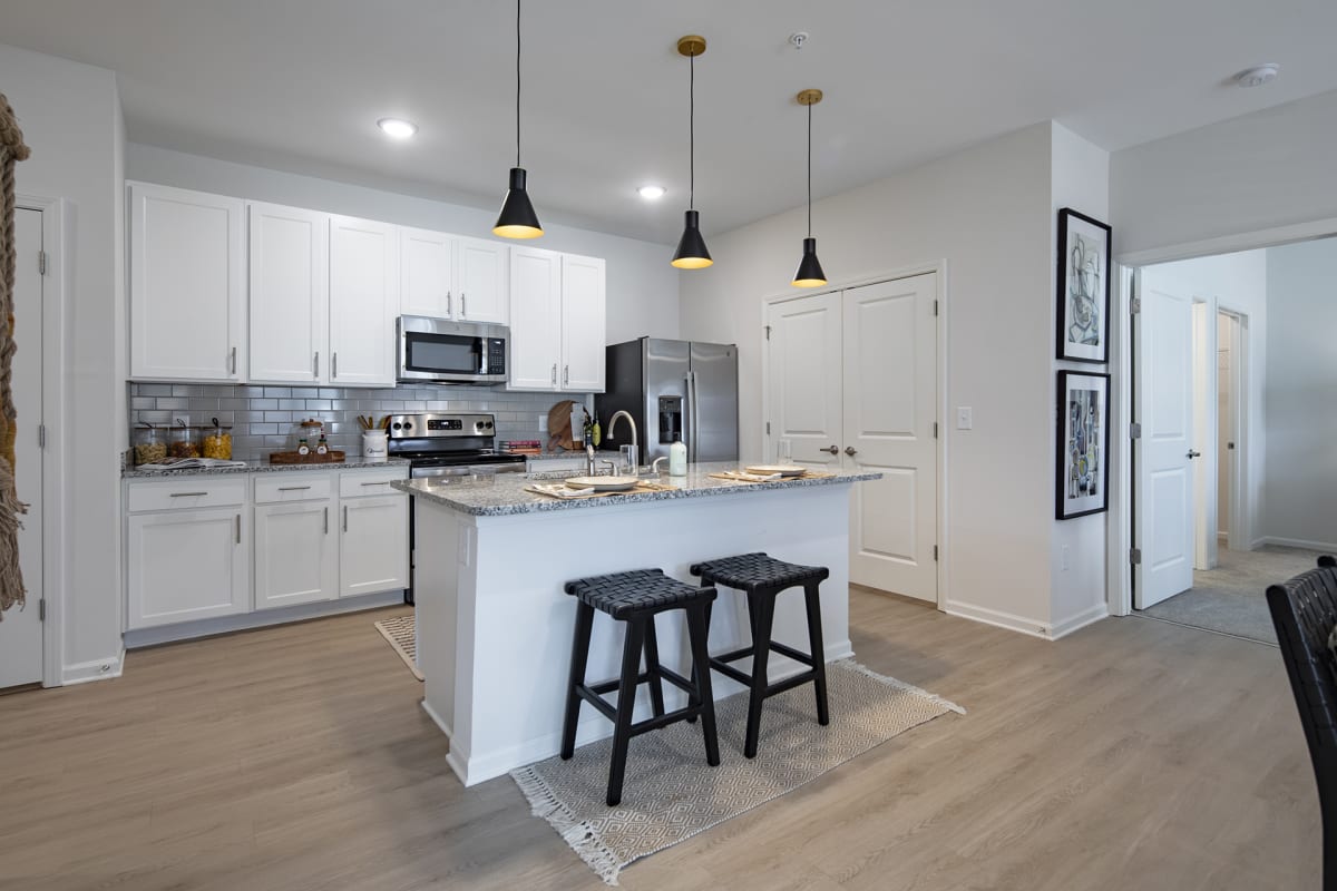 Waterleaf at Cold Springs apartment kitchen with island - Huntsville, AL