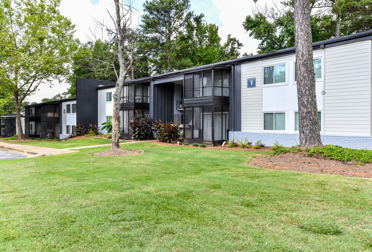 The Flats @ 1885 Apartments exterior buildings and landscaping - Lake City, GA