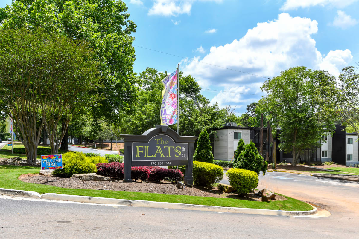 The Flats @ 1885 Apartments community sign - Lake City, GA