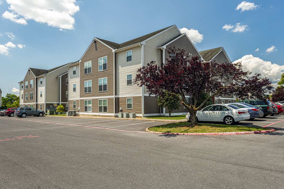 The Mill Apartments exterior and parking area - Harrisonburg, VA