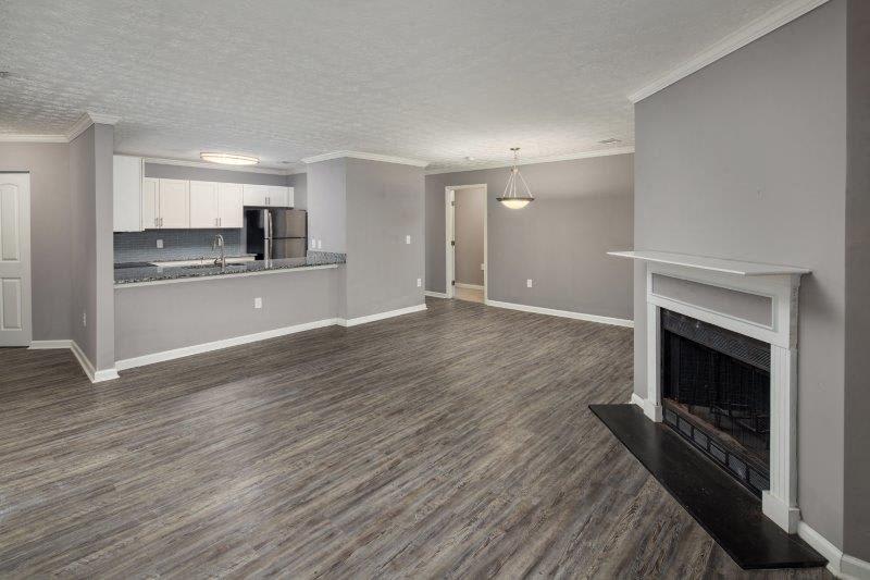 Midland Falls Apartment Homes living room with fireplace - Columbus, GA