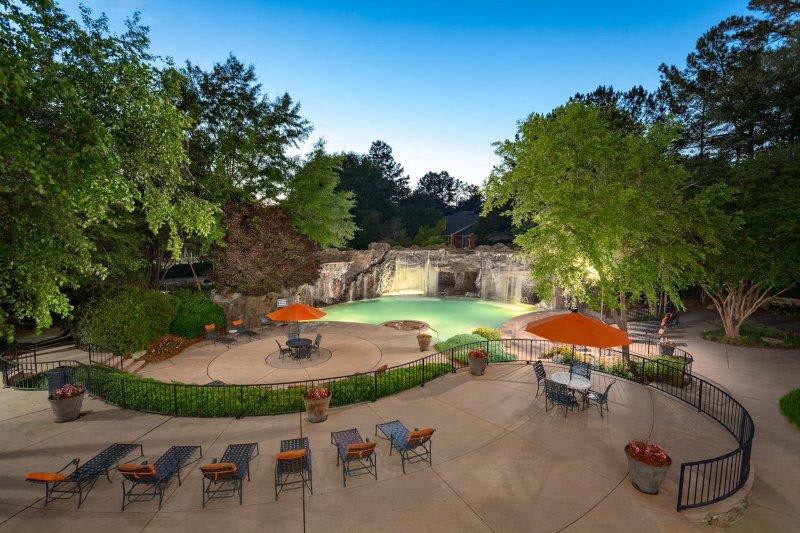Midland Falls Apartment Homes pool area with seating - Columbus, GA