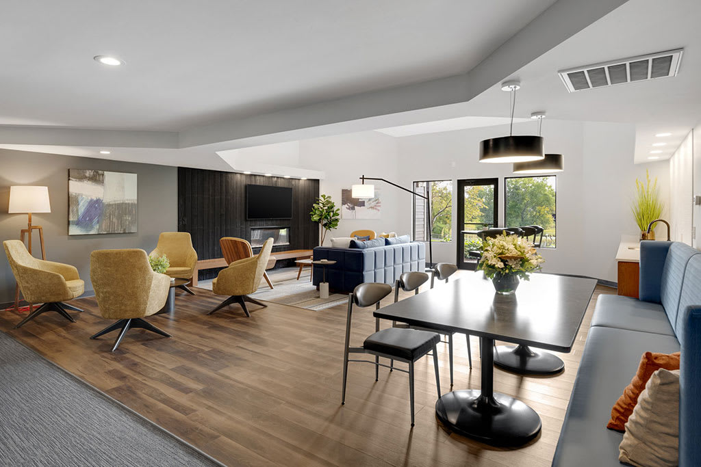 Tylia Apartments resident lounge with fireplace and TV - Maple Grove, MN