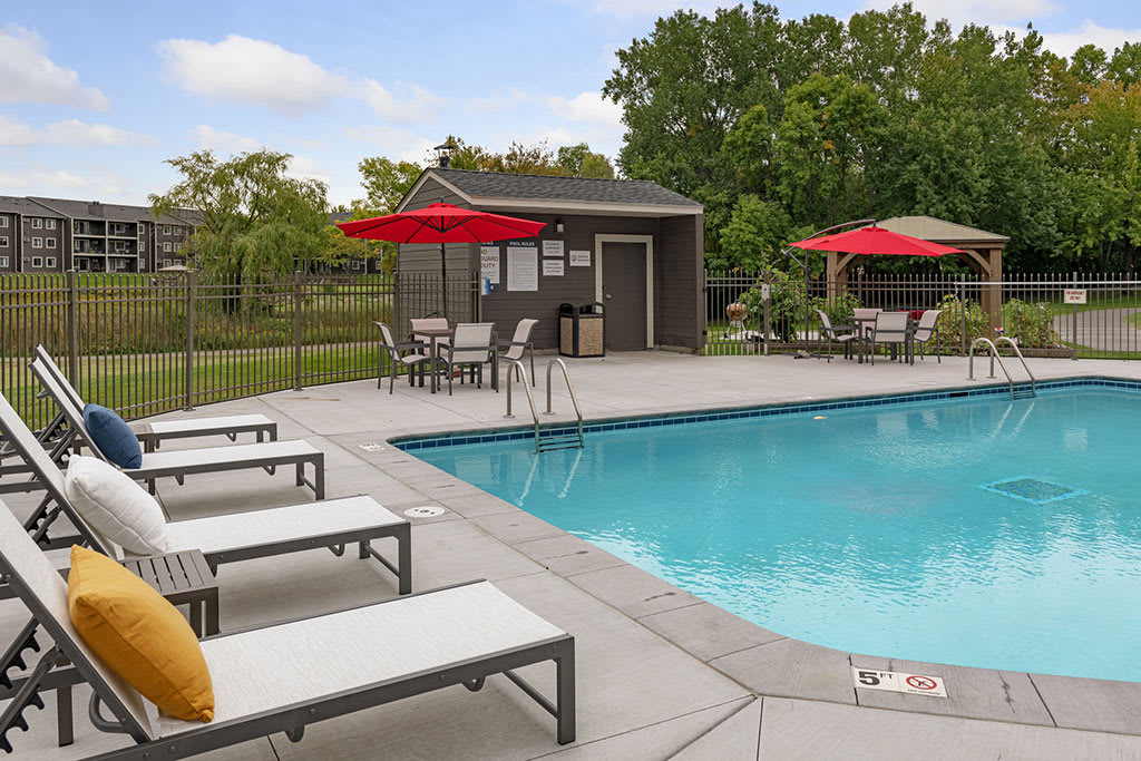 Tylia Apartments pool with lounge chairs - Maple Grove, MN