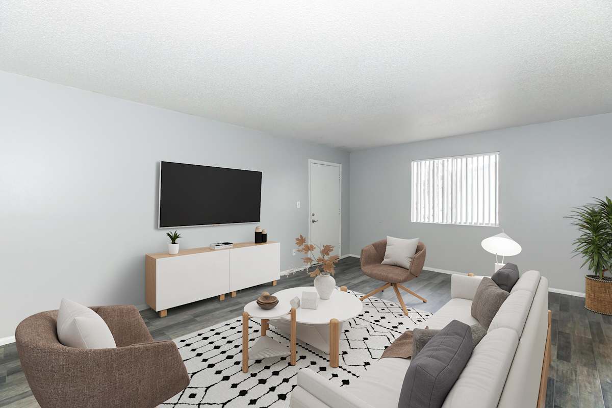 Furnished apartment living area shown at The Cara Apartments.