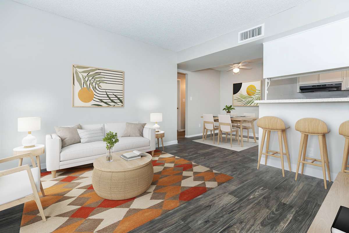 Furnished apartment living area shown at The Cara Apartments.