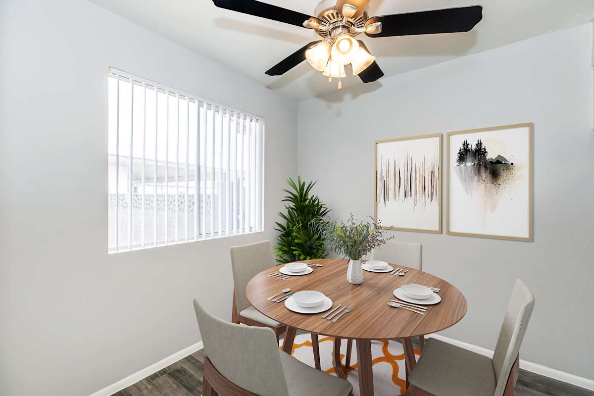 Furnished dining area shown at The Cara Apartments.
