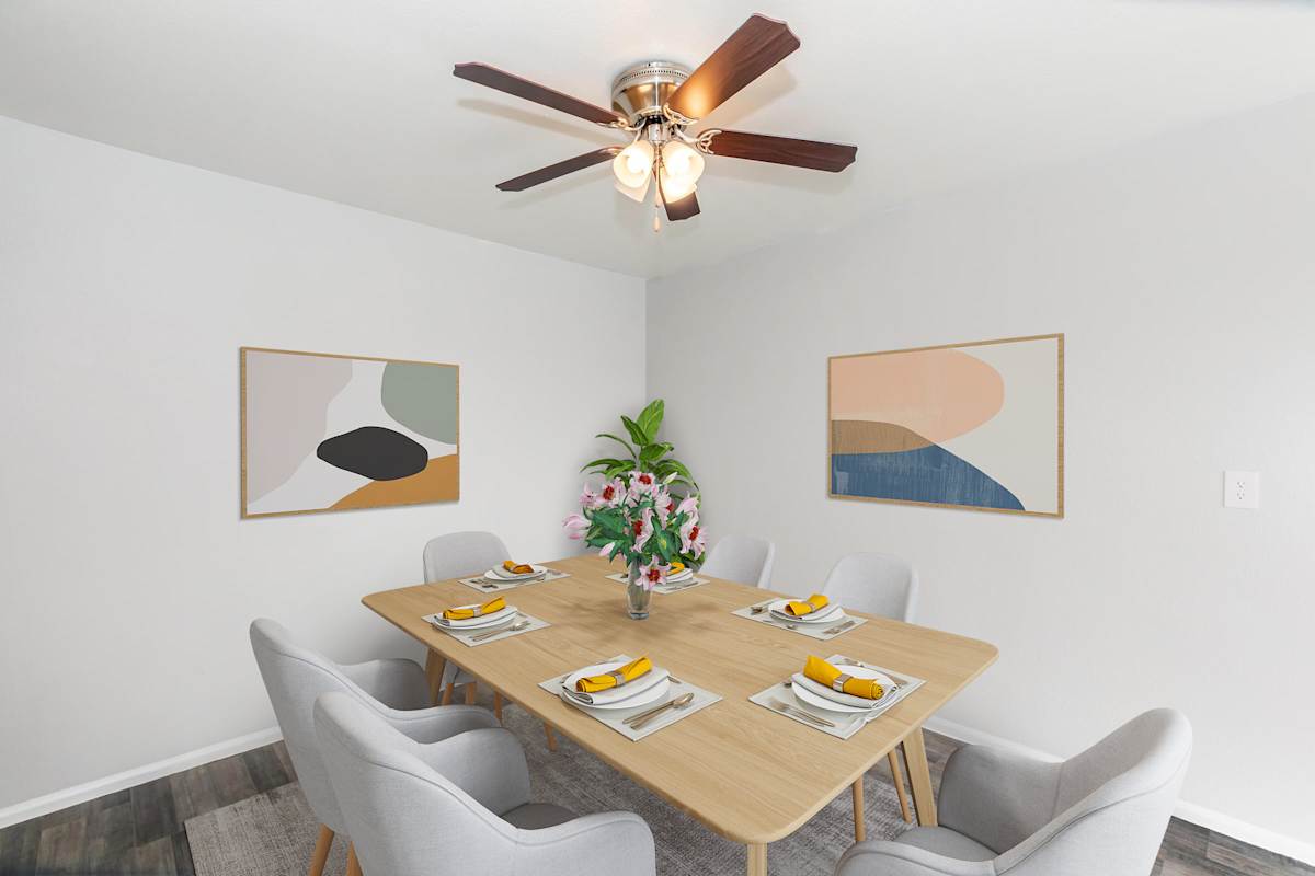 Furnished dining area shown at The Cara Apartments.