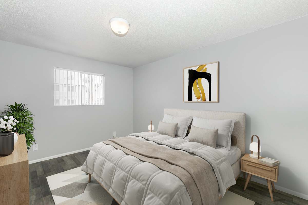 Furnished bedroom shown at The Cara Apartments.