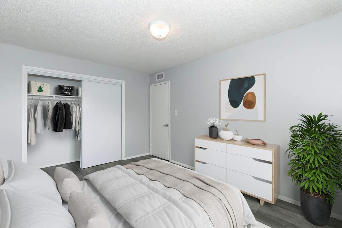 Furnished bedroom shown at The Cara Apartments.