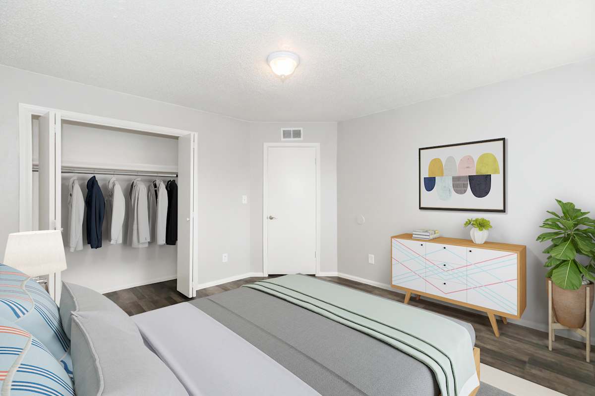 Furnished bedroom shown at The Cara Apartments.