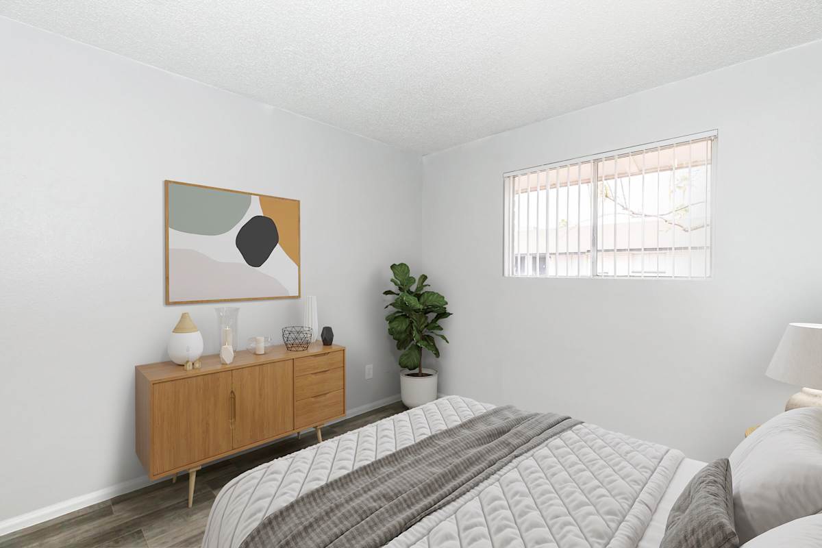 Furnished bedroom shown at The Cara Apartments.