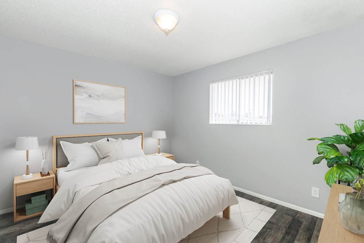 Furnished bedroom shown at The Cara Apartments.