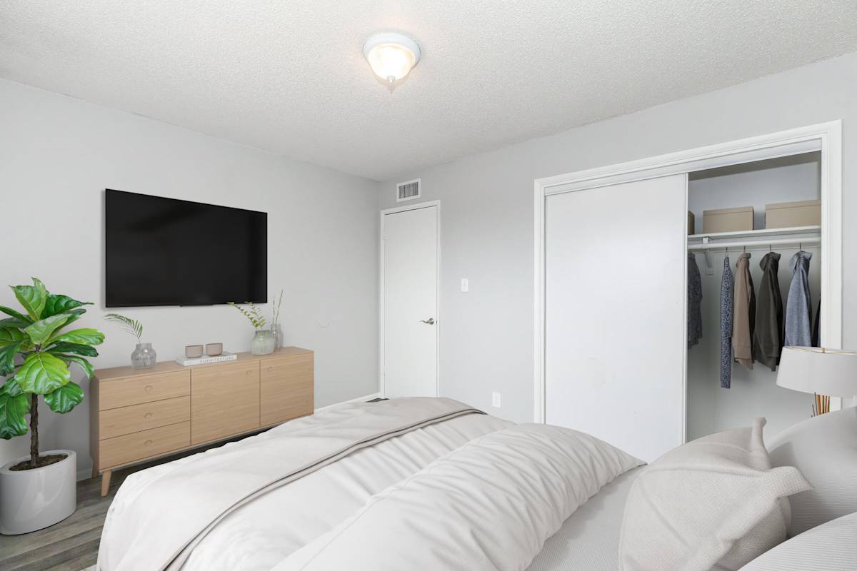 Furnished bedroom shown at The Cara Apartments.
