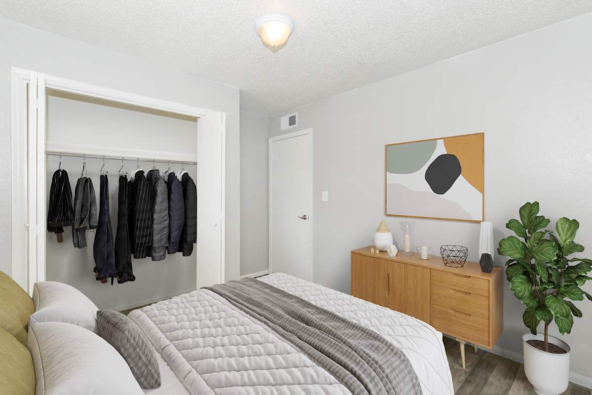 Furnished bedroom shown at The Cara Apartments.