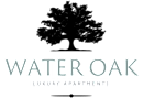 A black and white image of a sign that says Water Oak Luxury Apartments.