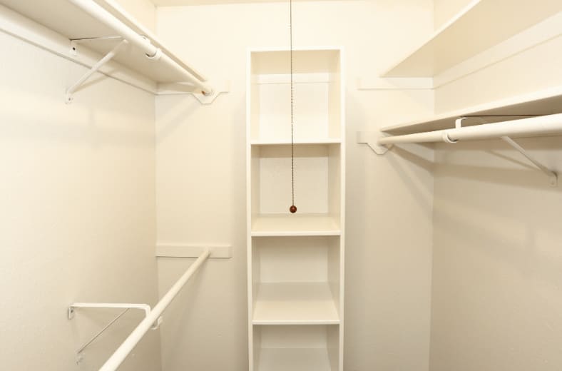Closet storage — representative home at The Summit Apartments.
