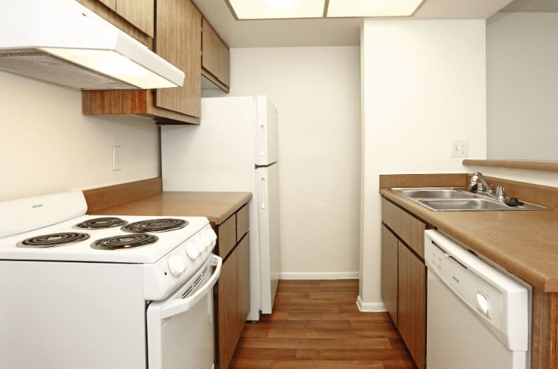 Apartment kitchen — representative home at The Summit Apartments.