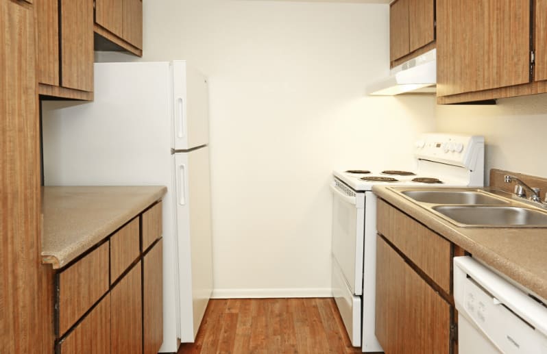 Apartment kitchen — representative home at The Summit Apartments.