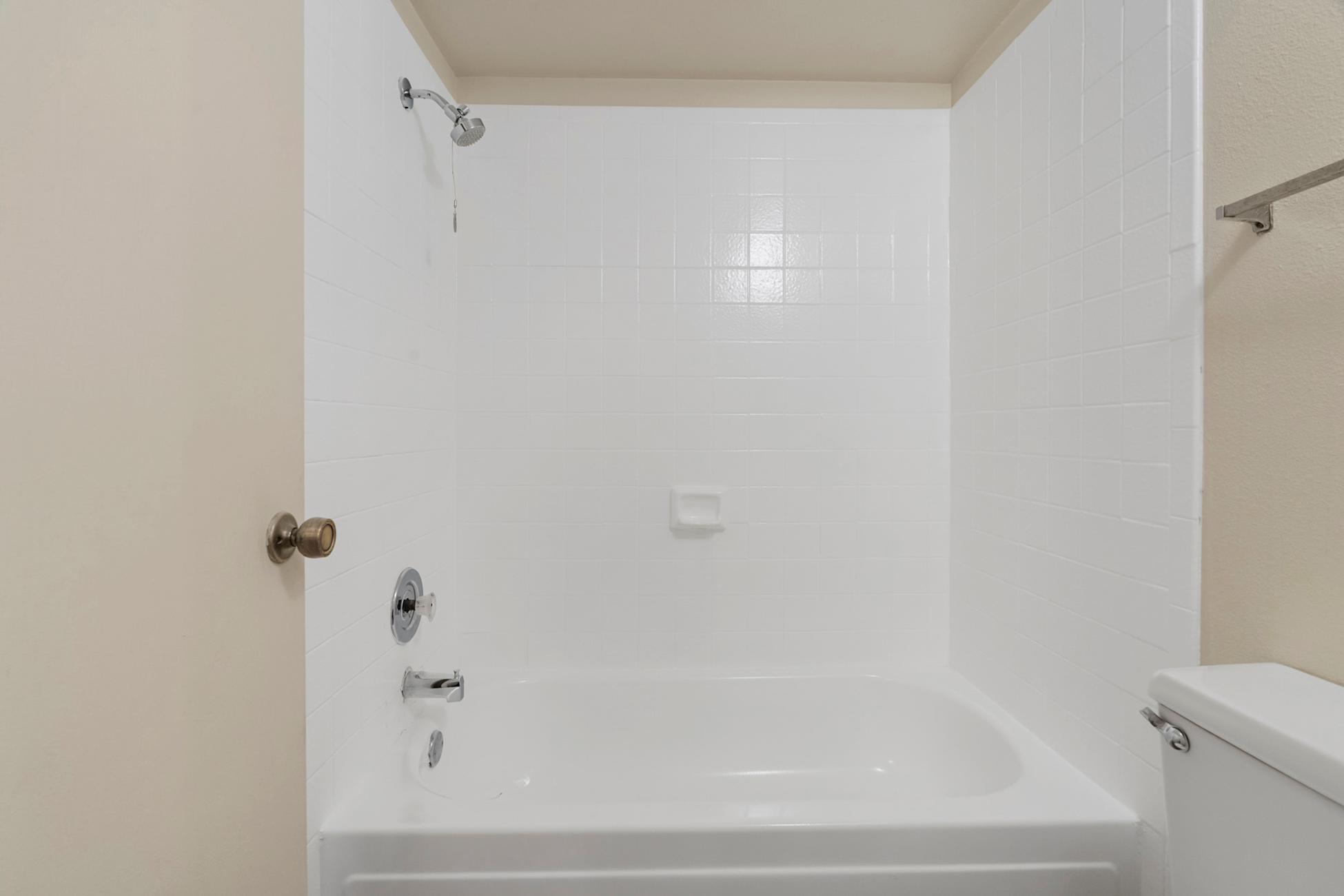 Apartment bathroom — representative home at Townhomes on the Park Apartment Homes.