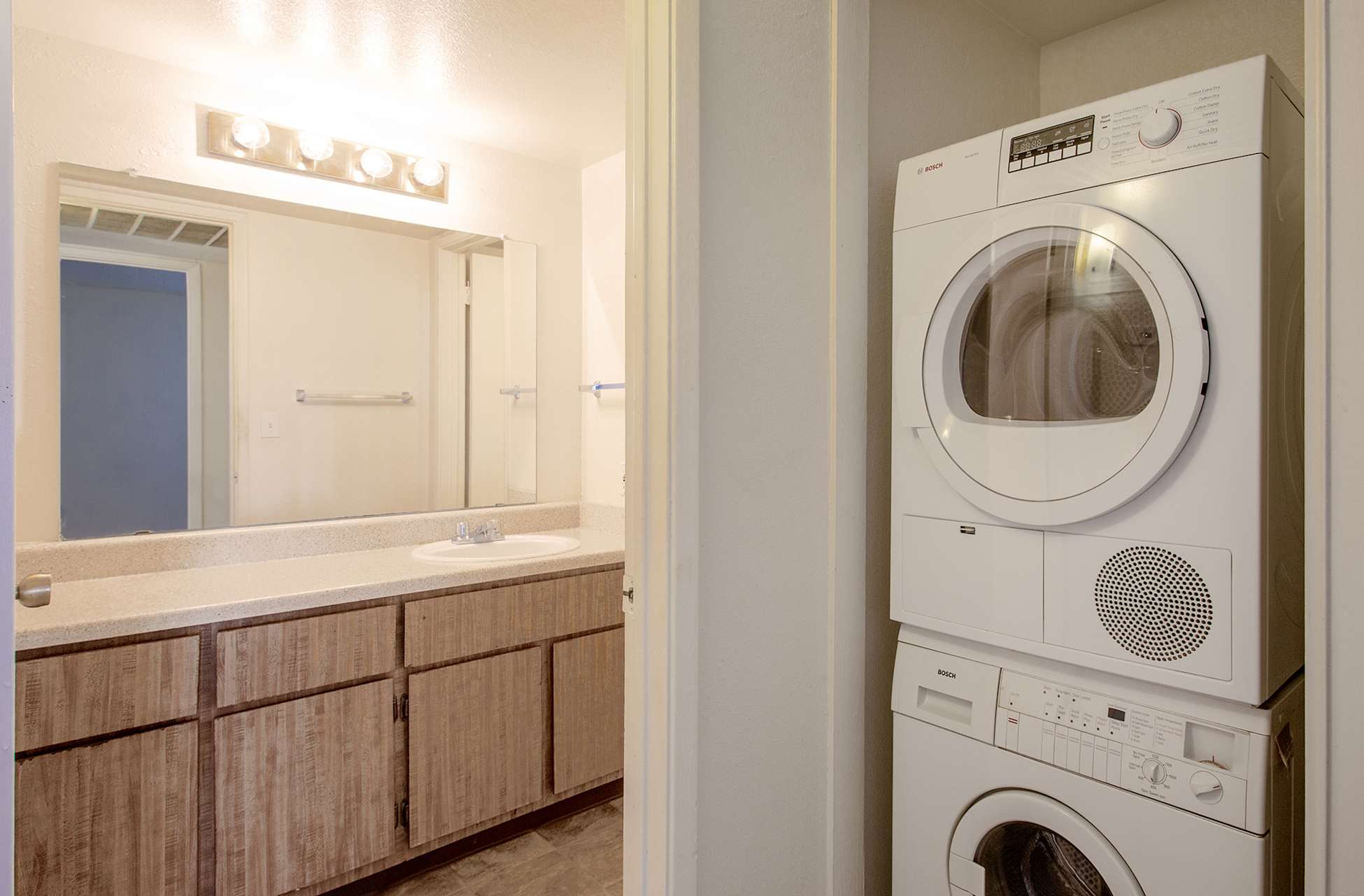 In-home laundry area — representative home at Townhomes on the Park Apartment Homes.