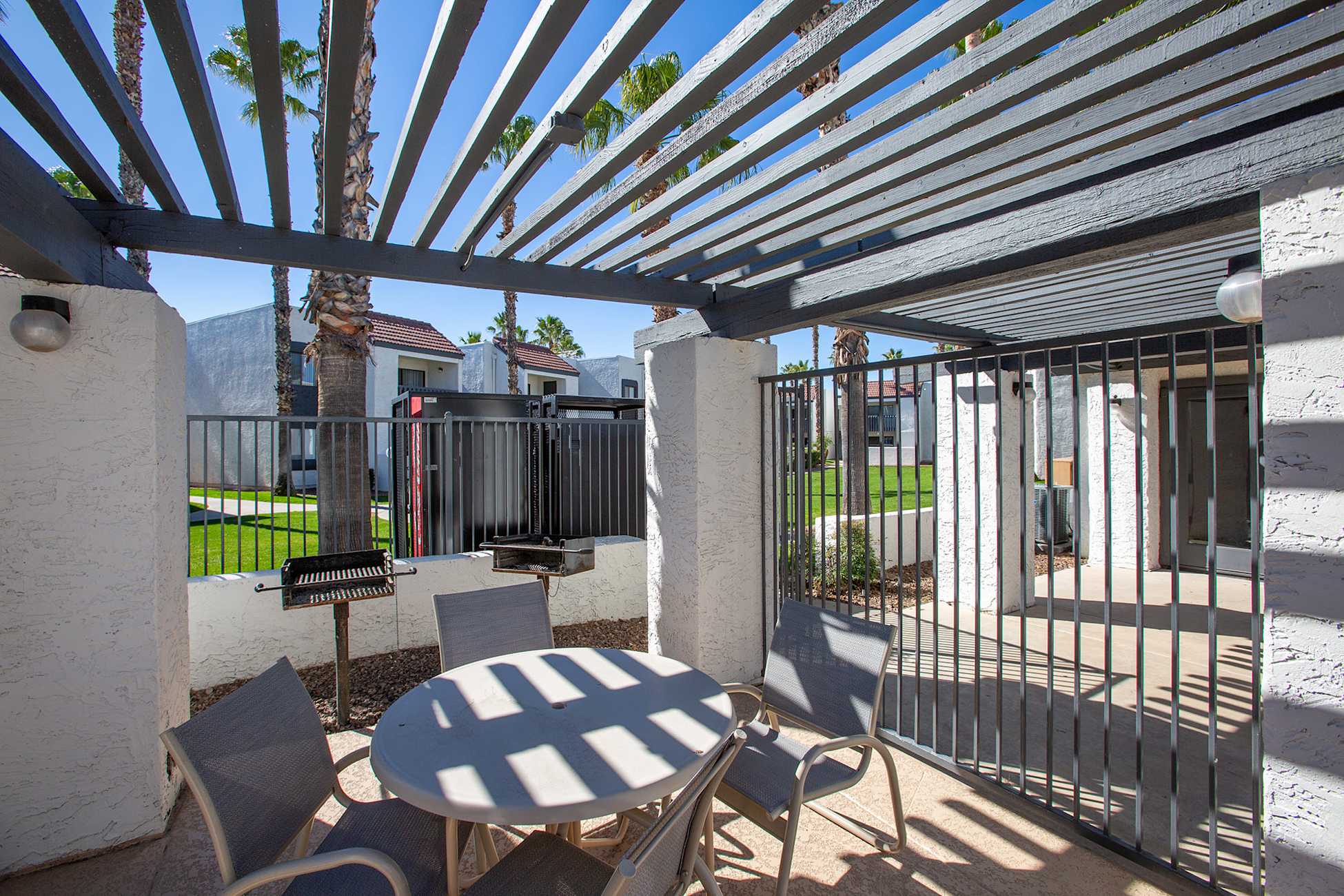 Outdoor grills at Townhomes on the Park Apartment Homes.