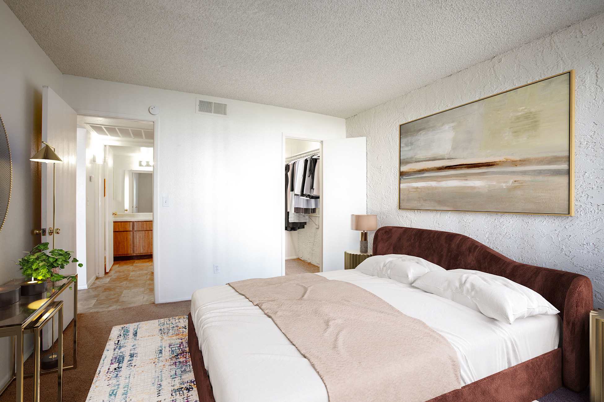 Furnished bedroom shown — representative home at Townhomes on the Park Apartment Homes.