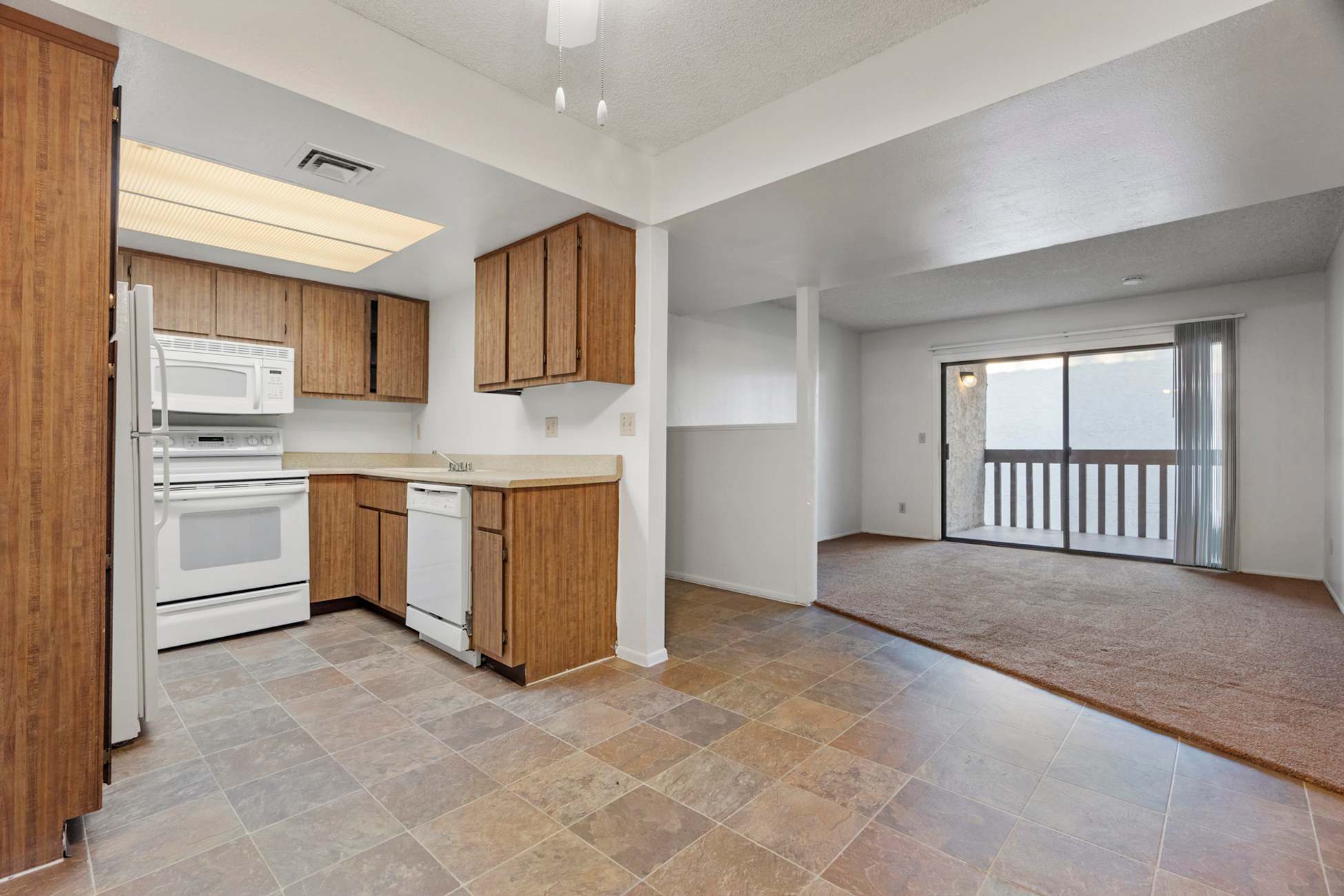 Apartment kitchen — representative home at Townhomes on the Park Apartment Homes.