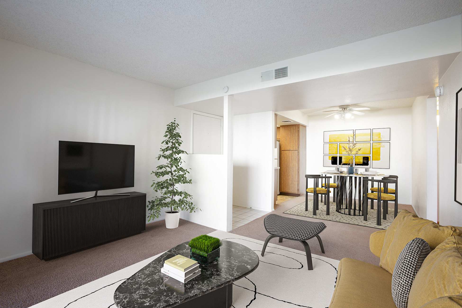 Furnished apartment living area shown — representative home at Townhomes on the Park Apartment Homes.