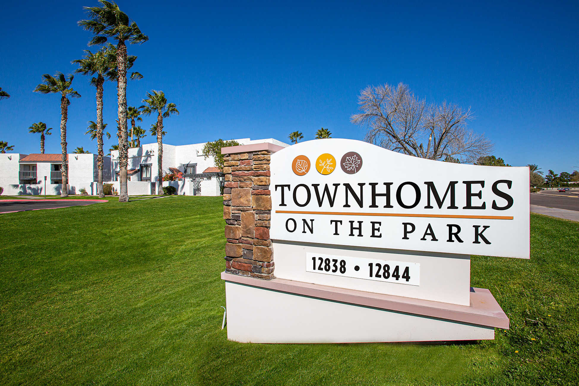 Building exterior at Townhomes on the Park Apartment Homes.