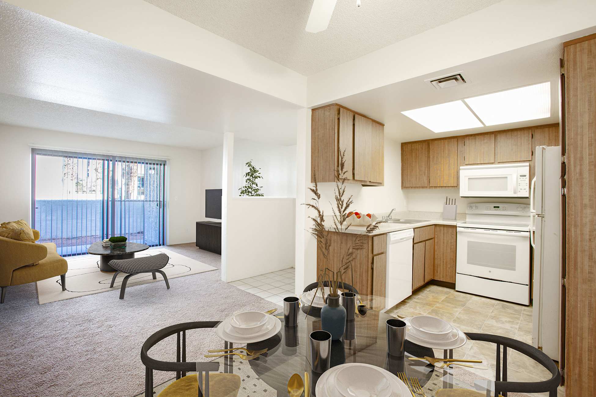Furnished apartment living area shown — representative home at Townhomes on the Park Apartment Homes.
