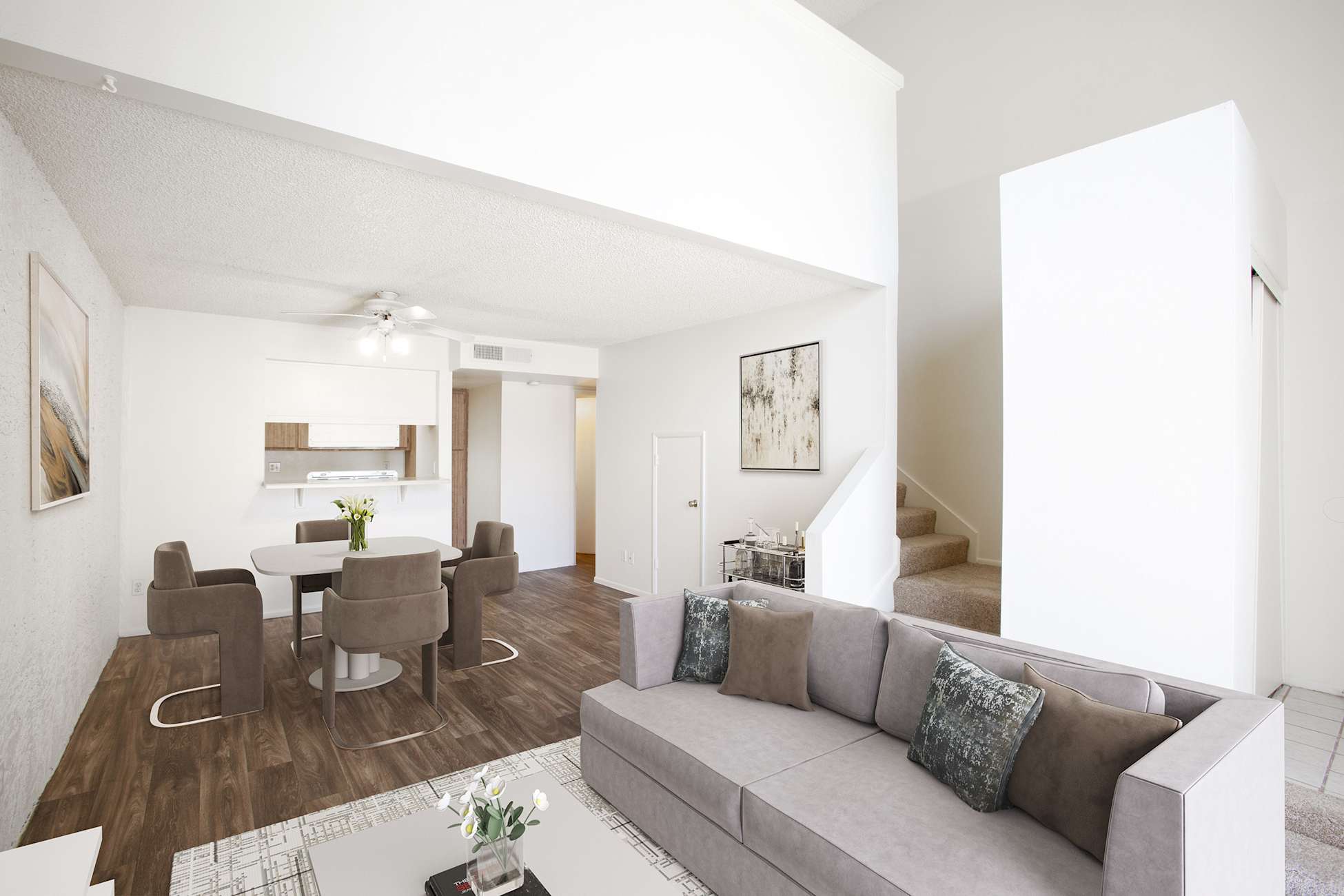 Furnished apartment living area shown — representative home at Townhomes on the Park Apartment Homes.