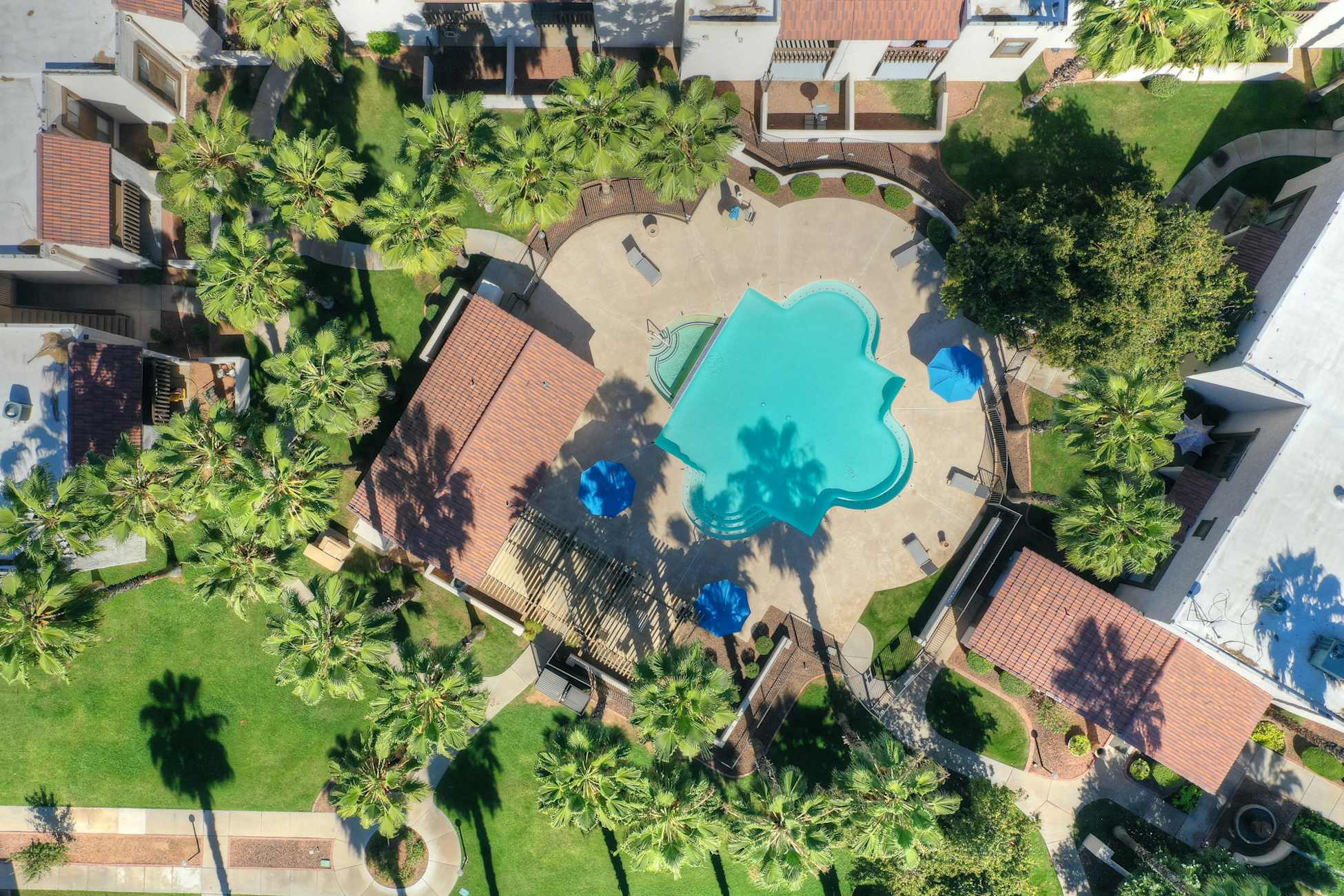 Pool and poolside area at Townhomes on the Park Apartment Homes.