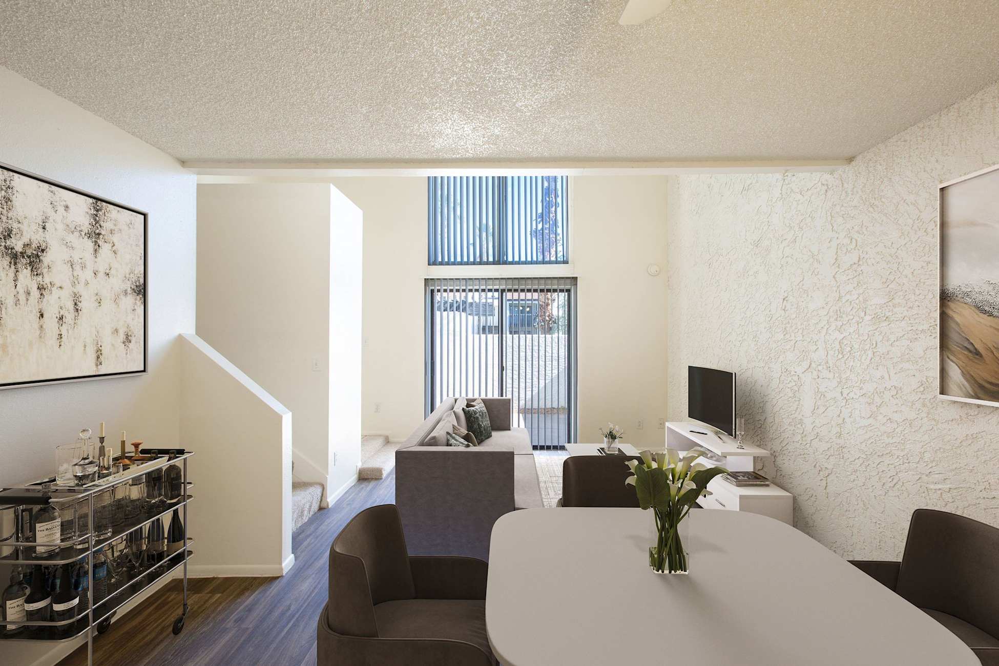 Furnished apartment living area shown — representative home at Townhomes on the Park Apartment Homes.