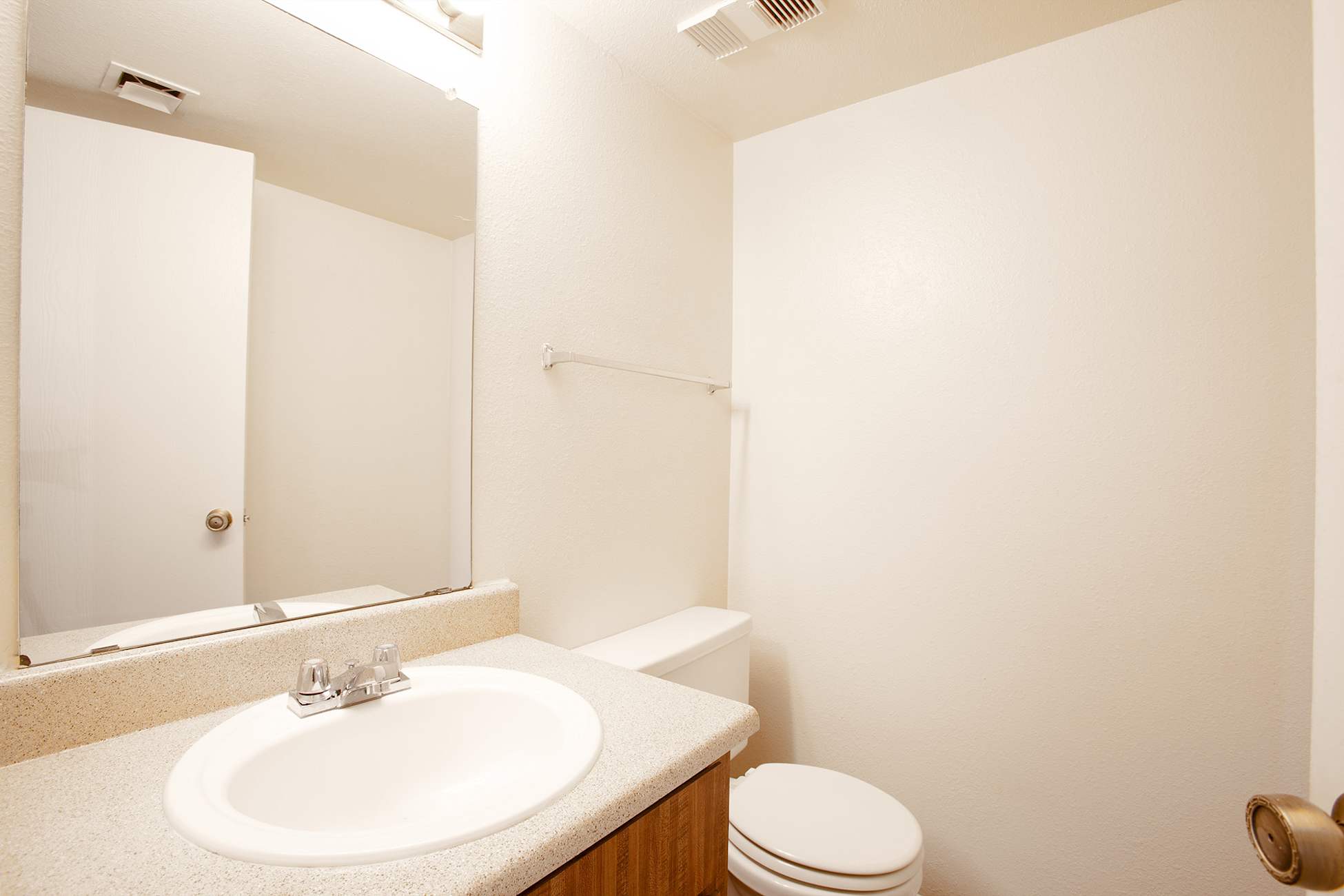 Apartment bathroom — representative home at Townhomes on the Park Apartment Homes.