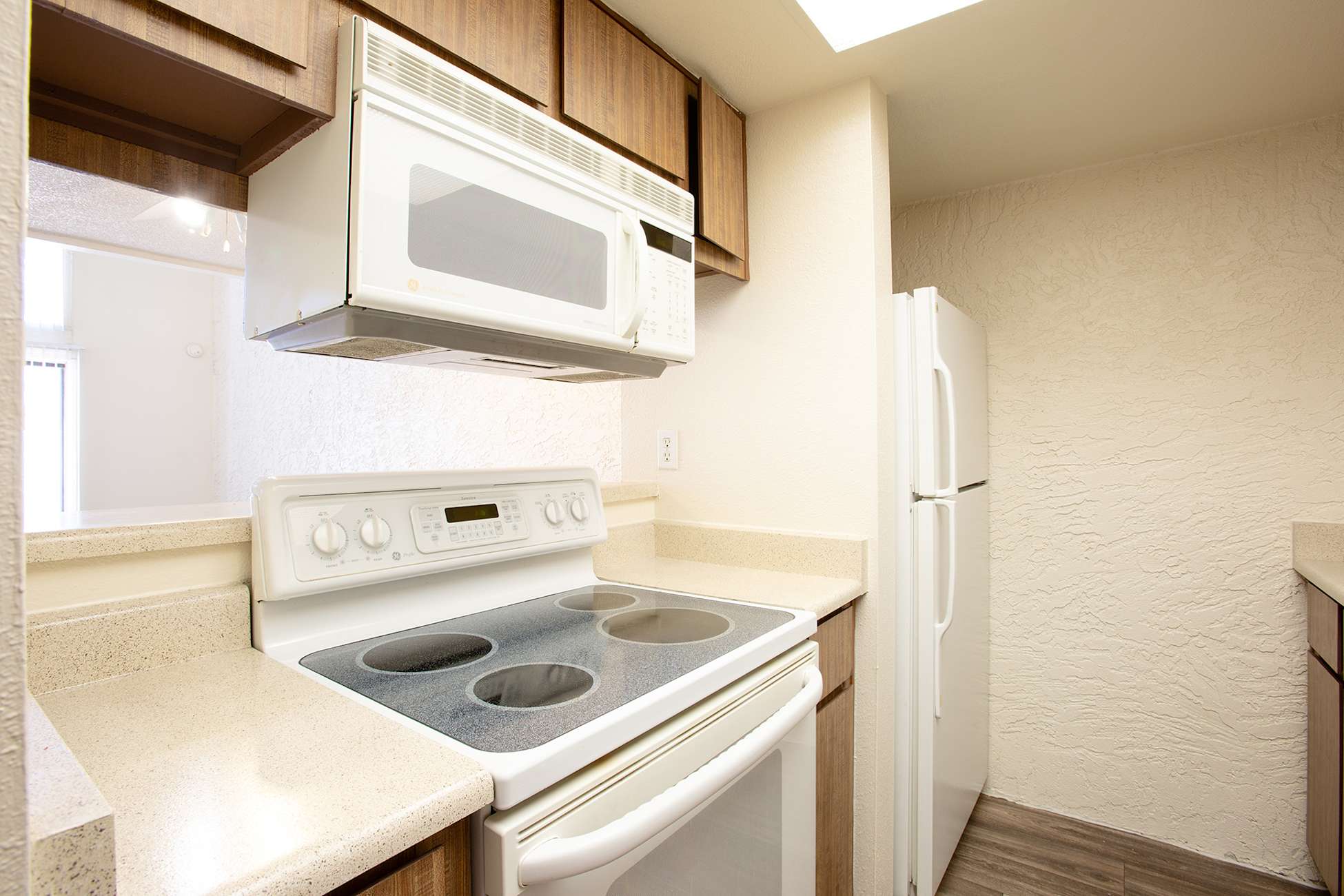 Apartment kitchen — representative home at Townhomes on the Park Apartment Homes.