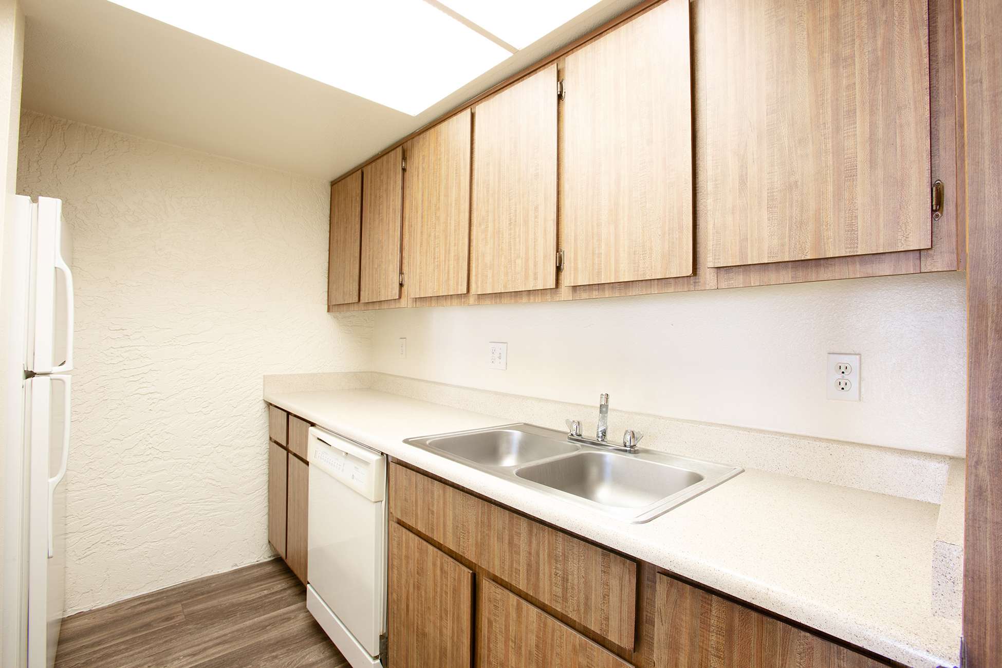 Apartment kitchen — representative home at Townhomes on the Park Apartment Homes.