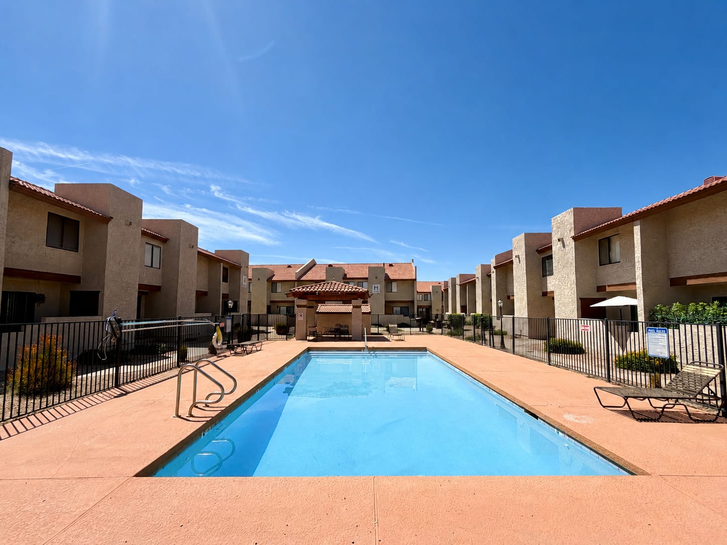 Pool and poolside area at Windsprings Apartments.